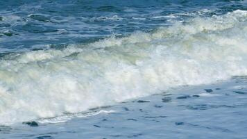 Sea Waves Break On Pebble Beach. Wave Motion On The Shoreline With Foam And Pebbles. Still. video