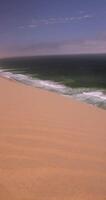 Video pan over the dunes of Sandwich Harbor in Namibia during the day