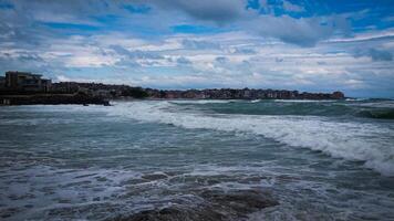 A fragment of the old town of Sozopol, Bulgaria. The sea after the rain photo