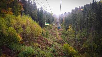 Cable car in autumn Carpathian mountains photo