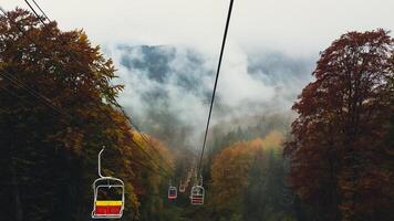 Cable car in autumn Carpathian mountains photo