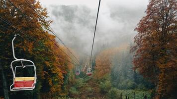 Cable car in autumn Carpathian mountains photo