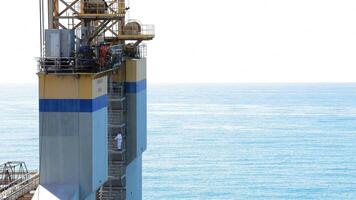 People walking in a tower of a maritime platform video