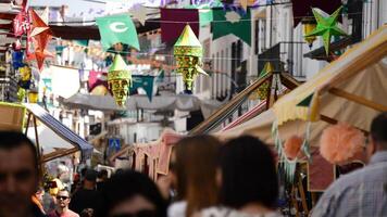 Cartama, Spain, 2017 - People walking through a market medieval Moorish in Spain video