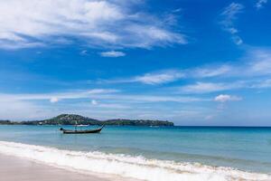 Longtail boat in the beautiful sea over clear sky. Thailand. photo