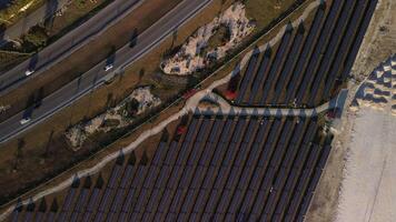 Solar panel rows and highway aerial view. Photovoltaic panels farm. Dominican video