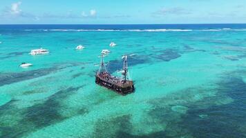 Pirate ship floating in caribbean sea. Dominican Republic. Aerial top view video