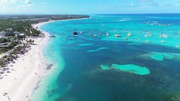 Aerial flight above the public Bavaro beach with white sand. Dominican republic video