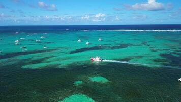 Following a boat with a drone, caribbean sea of Dominican Republic, blue waters video