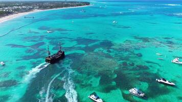 Pirate ship floating in caribbean sea. Dominican Republic. Aerial top view video