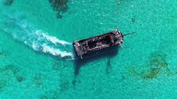 Pirate ship floating in caribbean sea. Dominican Republic. Aerial top view video