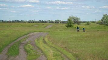 Man and boy ride bikes On Countryside. Active lifestyle concept. 4K video