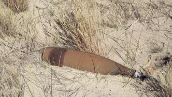 Unexploded ordnance in a field after hostilities. Dangerous find video