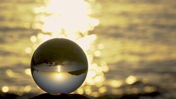 View of the sea through a glass sphere. Meditative video. 4K video