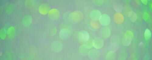 Green and yellow defocus lights. Bokeh, blurred defocus background. Abstract green. photo