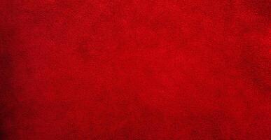 Suede genuine leather is red as a background. Red velvet material web size. photo