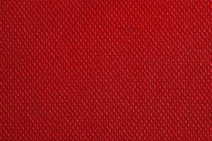 Red fabric as background macro photo. Fabric texture. photo