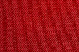 Red fabric as background macro photo. Fabric texture. photo