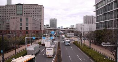 A traffic jam at the city street in Tokyo wide shot cloudy day video