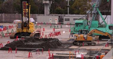 Moving cranes at the under construction in Tokyo telephoto shot video