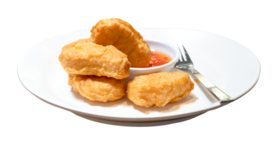 Front view of chicken nuggets with chili sauce in white plate isolated with clipping path in png file format