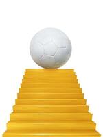 A soccer ball is displayed on a golden staircase. photo