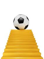 A soccer ball is displayed on a golden staircase. photo