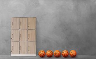 Lockers in the gym with basketballs on the cement floor photo