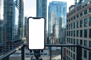 ai generado teléfono inteligente en trípode con blanco pantalla, paisaje urbano en suave atención en el fondo, Listo para contenido creación foto