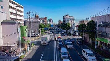 une laps de temps de le circulation confiture à le centre ville rue dans tokyo inclinaison video