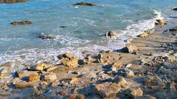 Beautiful rocks cliffs view waves at beach coast panorama Mexico. video