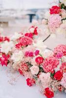 Bouquet of colorful flowers stands on the pier photo