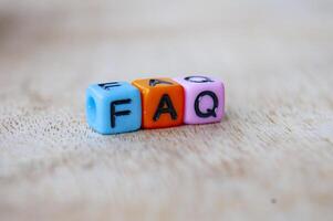 Close up of FAQ letters representing frequently asked question photo