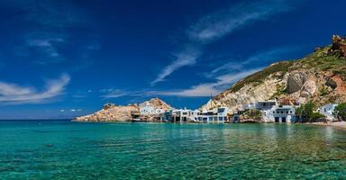 The beach of Firapotamos in Milos, Greece photo