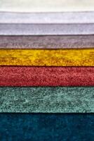 Multi colored set of upholstery fabric samples for selection, collection of textile swatches photo