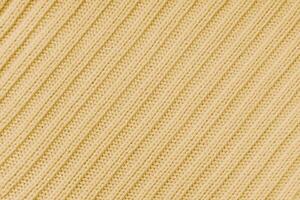 Jersey textile background , yellow diagonal striped knitted fabric, cloth surface photo