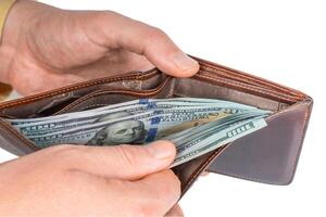 Man hands holding a wallet with dollars, counting money photo