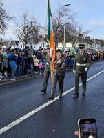 Galway, Ireland  03.17.2024 Saint Patrick's Day parade passing trough Galway city in Ireland photo