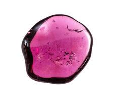 polished rhodolite crystal isolated on white photo