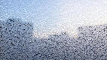 panoramic frosty pattern on window of apartment photo