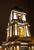 illuminated bell tower in Moscow in winter evening photo