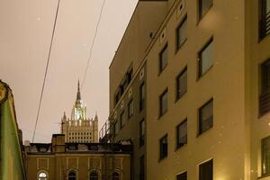 courtyard and view of Stalins skyscraper in Moscow photo