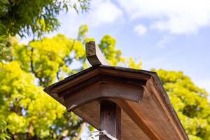 A Japanese traditonal roof at Tomioka Shrine photo