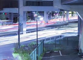 A night traffic jam at the urban street in Tokyo photo