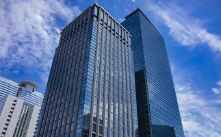 A cloud reflecting the building in the business town wide shot photo