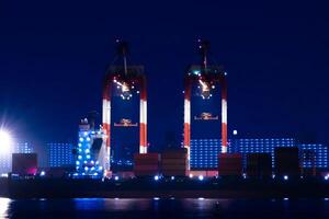 Night cranes near the container port in Tokyo long shot photo