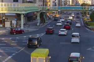 A traffic jam at the large crossing in Kyoto daytime photo