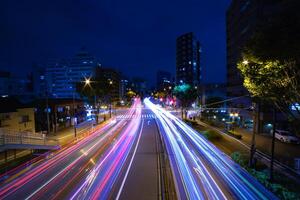 A night traffic jam at the city crossing in Tokyo wide shot photo