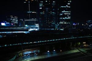 A night panoramic cityscape in front of Tokyo station wide shot photo