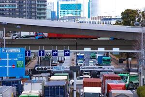 A traffic jam at the city street near the highway in Tokyo telephoto shot photo